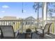 Inviting back porch with comfortable seating, perfect for relaxing and enjoying the outdoor view at 4155 Hibiscus Dr. # 204, Little River, SC 29566