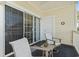 Inviting balcony offers a relaxing seating area with comfortable chairs and a table, perfect for enjoying the outdoors at 4155 Hibiscus Dr. # 204, Little River, SC 29566