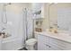 Well-lit bathroom featuring a shower-tub combination, a vanity with storage, and a decorative shower curtain at 4155 Hibiscus Dr. # 204, Little River, SC 29566