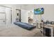 This bedroom features a work area, hardwood floors, and a TV at 4155 Hibiscus Dr. # 204, Little River, SC 29566