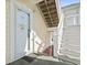 Condo entrance showing unit number 204, white door, and stairs at 4155 Hibiscus Dr. # 204, Little River, SC 29566