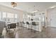 Well-lit kitchen featuring white cabinets, modern appliances, and a breakfast bar with seating at 4155 Hibiscus Dr. # 204, Little River, SC 29566
