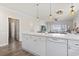 Kitchen island with white cabinets overlooking the living room at 4155 Hibiscus Dr. # 204, Little River, SC 29566