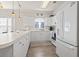 Well-lit kitchen with white cabinets, laminate countertops, and stainless sink at 4155 Hibiscus Dr. # 204, Little River, SC 29566