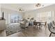Bright living room with stylish furnishings, ceiling fan, and sliding glass doors to the outside patio at 4155 Hibiscus Dr. # 204, Little River, SC 29566
