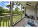 Balcony featuring patio furniture and a view of the lush greenery and pond at 45 Pinehurst Ln. # 2G, Pawleys Island, SC 29585