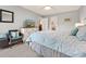 Serene bedroom with a bed and dresser, complemented by light-colored walls and connecting to the dining area at 45 Pinehurst Ln. # 2G, Pawleys Island, SC 29585