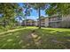 View of the exterior of multiple units with green spaces and mature trees, providing a serene setting at 45 Pinehurst Ln. # 2G, Pawleys Island, SC 29585