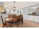Stylish dining area featuring an open kitchen, creating an inviting and sociable space for meals and gatherings at 45 Pinehurst Ln. # 2G, Pawleys Island, SC 29585
