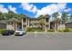 Inviting condo complex with multiple levels, tidy landscaping, and ample parking for residents and guests at 45 Pinehurst Ln. # 2G, Pawleys Island, SC 29585
