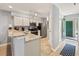 Bright kitchen with granite countertops, stainless steel appliances, and a convenient layout for cooking and dining at 45 Pinehurst Ln. # 2G, Pawleys Island, SC 29585