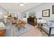 Comfortable living room with a view into the dining area, featuring a large television and modern furnishings at 45 Pinehurst Ln. # 2G, Pawleys Island, SC 29585