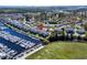 Aerial view showcases the marina, residential buildings, and surrounding green spaces at 4633 Lightkeepers Way # 5H, Little River, SC 29566