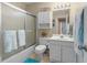 Clean bathroom featuring a shower, storage cabinet, and bright lighting for daily convenience at 4633 Lightkeepers Way # 5H, Little River, SC 29566