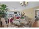 Bright dining area features stylish wicker furniture and a water view at 4633 Lightkeepers Way # 5H, Little River, SC 29566