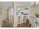 Charming dining area features bar seating with wicker chairs and modern lighting at 4633 Lightkeepers Way # 5H, Little River, SC 29566