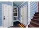 Charming condo entrance with blue siding and a 'Welcome' mat at 4633 Lightkeepers Way # 5H, Little River, SC 29566