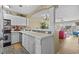 Well-lit kitchen featuring ample counter space, white cabinetry, and stainless steel appliances at 4633 Lightkeepers Way # 5H, Little River, SC 29566