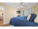 Comfortable bedroom featuring a ceiling fan, TV, and balcony access for relaxing and enjoying the view at 4633 Lightkeepers Way # 5H, Little River, SC 29566