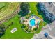 Aerial view showcasing community pool, golf course, and green areas at 4865 Magnolia Pointe Ln. # 204, Myrtle Beach, SC 29577