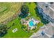 Aerial view of a community pool with surrounding greenery at 4865 Magnolia Pointe Ln. # 204, Myrtle Beach, SC 29577