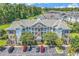 Aerial view of complex featuring a well-manicured property with ample parking and lush landscaping at 4865 Magnolia Pointe Ln. # 204, Myrtle Beach, SC 29577