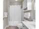 Neat bathroom featuring a shower/tub combo, storage cabinet, vanity, and tile flooring at 4865 Magnolia Pointe Ln. # 204, Myrtle Beach, SC 29577