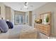 Comfortable bedroom with a ceiling fan, neutral walls, and natural light from multiple windows at 4865 Magnolia Pointe Ln. # 204, Myrtle Beach, SC 29577