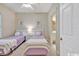 Bright bedroom with two twin beds, neutral walls, and ensuite bathroom at 4865 Magnolia Pointe Ln. # 204, Myrtle Beach, SC 29577