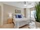 Bright bedroom with neutral walls, side tables, and a large window providing natural light at 4865 Magnolia Pointe Ln. # 204, Myrtle Beach, SC 29577