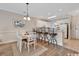 Cozy dining area with a wooden table, chairs, hardwood floors, and a view of the kitchen at 4865 Magnolia Pointe Ln. # 204, Myrtle Beach, SC 29577