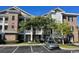 Attractive condominium exterior with well-maintained landscaping and ample parking at 4865 Magnolia Pointe Ln. # 204, Myrtle Beach, SC 29577
