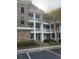 Attractive condominium building with multiple stories, exterior balconies, and well-maintained landscaping at 4865 Magnolia Pointe Ln. # 204, Myrtle Beach, SC 29577