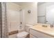 Simple bathroom with shower/tub, neutral sink and countertop, toilet, and patterned shower curtain at 500 Fairway Village Dr. # 5D, Myrtle Beach, SC 29588