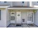 Close-up of multiple condo unit doors with welcome wreaths on the white siding at 500 Fairway Village Dr. # 5D, Myrtle Beach, SC 29588