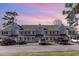 View of condo complex with neutral siding, black shutters, and ample parking spaces at 500 Fairway Village Dr. # 5D, Myrtle Beach, SC 29588