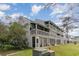 Condo exterior showing screened patios and multiple levels of wood decks at 500 Fairway Village Dr. # 5D, Myrtle Beach, SC 29588