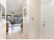 Inviting hallway leads to a living room with sliding glass doors to the porch and tiled floor at 500 Fairway Village Dr. # 5D, Myrtle Beach, SC 29588