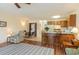 Open-concept living space featuring a bar with seating, a laundry closet, and cozy furnishings at 500 Fairway Village Dr. # 5D, Myrtle Beach, SC 29588