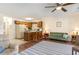 Inviting living room with bar seating, a comfortable sofa, and warm lighting, perfect for relaxation at 500 Fairway Village Dr. # 5D, Myrtle Beach, SC 29588