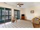 Inviting living room with balcony access, neutral walls, and a TV atop a wooden dresser at 500 Fairway Village Dr. # 5D, Myrtle Beach, SC 29588