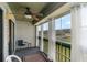 Screened porch with ceiling fan, porch furniture, and views of the community and open sky at 500 Fairway Village Dr. # 5D, Myrtle Beach, SC 29588