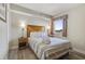 Serene bedroom with a comfortable bed, bedside lamps, and a bright window view at 504 N Ocean Blvd. # 411, Myrtle Beach, SC 29577