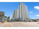 Contemporary condo building featuring blue and white facade and private balconies at 504 N Ocean Blvd. # 411, Myrtle Beach, SC 29577