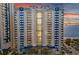 Oceanfront condominium with multiple balconies offering stunning ocean views at sunset at 504 N Ocean Blvd. # 411, Myrtle Beach, SC 29577