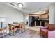 Open-concept dining area and kitchen with appliances, tile flooring, and wood cabinets at 504 N Ocean Blvd. # 411, Myrtle Beach, SC 29577