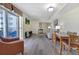 Bright living room with a balcony, grey floors and comfortable seating at 504 N Ocean Blvd. # 411, Myrtle Beach, SC 29577