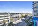 Street view of the building showing the street with palm trees on a clear day at 504 N Ocean Blvd. # 411, Myrtle Beach, SC 29577