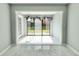 Bright sun room with marble floors and sliding glass doors to the outside at 515 37Th Ave. N # 101, Myrtle Beach, SC 29572