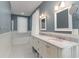 Elegant bathroom with double vanity, marble countertops, and stylish tile flooring at 53 Hope Ln., Pawleys Island, SC 29585